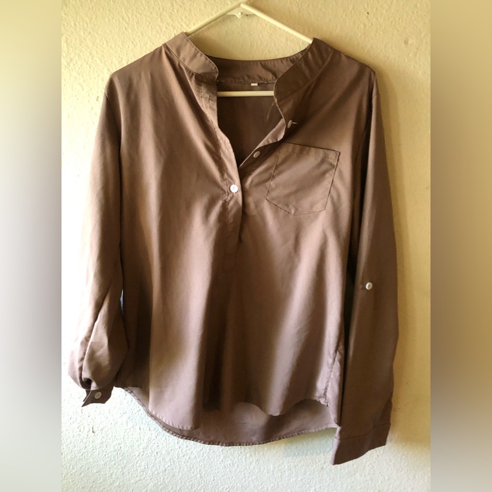 Satin blouse can button to make sleeves midway